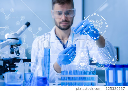 Chemist scientist holding test tube conducting experiment in laboratory with equipment. 125320237