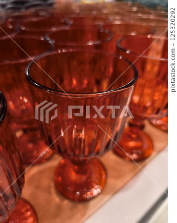 Elegant red glasses standing in a row, retail display in prague Elegant red glasses standing in a row, retail display in prague 125320292