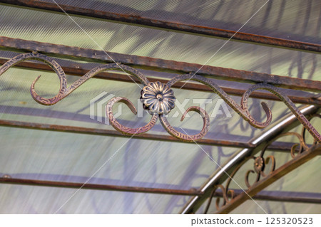 Forged elements of the canopy made of metal and a polycarbonate roof Forged elements of the canopy made of metal and a polycarbonate roof 125320523