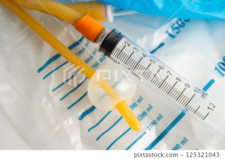 Foley catheter and urine drainage bag collect urine for disability or patient in hospital. 125321043