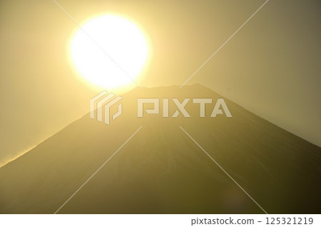 The sunrise over Mount Fuji, seen from Mount Ryugatake in the Tenshi Mountains - a huge sun The sunrise over Mount Fuji, seen from Mount Ryugatake in the Tenshi Mountains - a huge sun 125321219