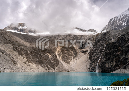 Laguna 69 with turquoise water and snowy mountains in Huaraz, Peru Laguna 69 with turquoise water and snowy mountains in Huaraz, Peru 125321535