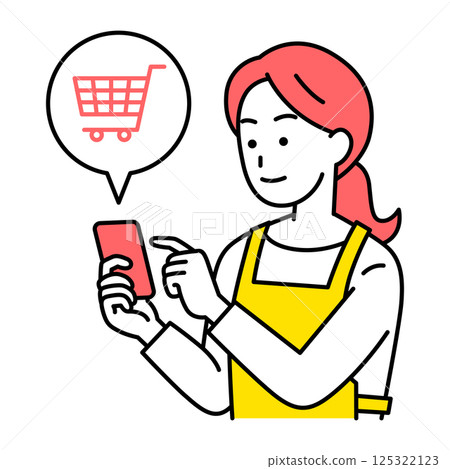 A woman in an apron doing online shopping on a smartphone 125322123