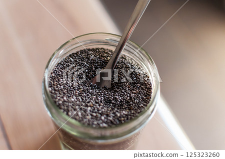 Chia seeds in a kitchen, superfood, full of antioxidant and omega 3, good for transit, sleep, bones, heart Chia seeds in a kitchen, superfood, full of antioxidant and omega 3, good for transit, sleep, bones, heart 125323260