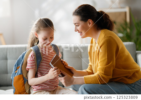Happy family preparing for school Happy family preparing for school 125323809