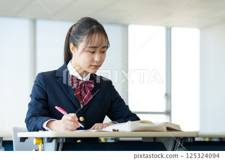 High school girls studying. Photo courtesy of Denpa Gakuen, Tokyo Electronics College. 125324094