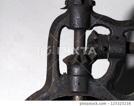 old iron coffee grinder detail 125325216