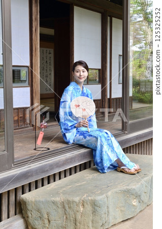 A young woman in a yukata A young woman in a yukata 125325252