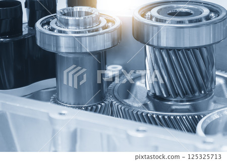 Close up scene the electric vehicle transmission gear parts in the light blue scene. Close up scene the electric vehicle transmission gear parts in the light blue scene. 125325713