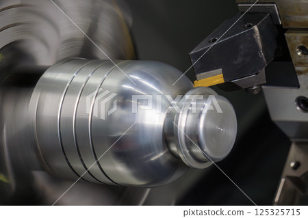 Close up scene the CNC lathe machine cutting the bottle core mold parts. 125325715