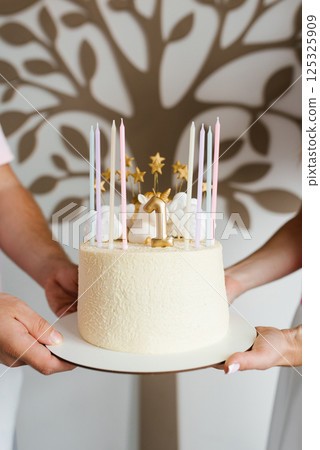 Parents Holding Unicorn Themed Birthday Cake 125325909