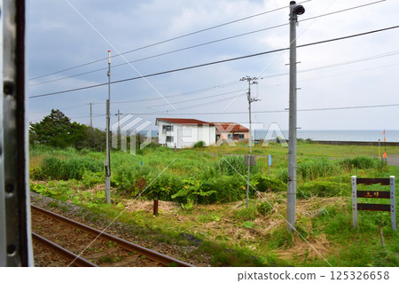 JR Hokkaido, Hakodate Main Line, local train window view from Yakumo Station to Oshamanbe Station (cloudy sky in summer 2023) JR Hokkaido, Hakodate Main Line, local train window view from Yakumo Station to Oshamanbe Station (cloudy sky in summer 2023) 125326658