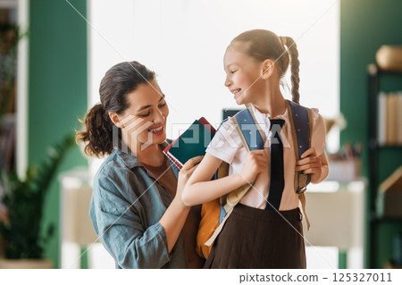 Happy family preparing for school 125327011