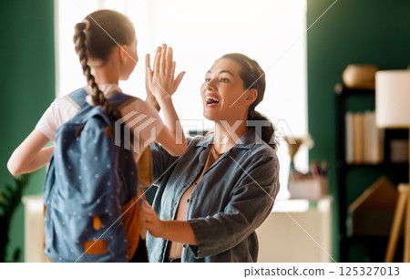 Happy family preparing for school Happy family preparing for school 125327013