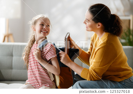Happy family preparing for school 125327018