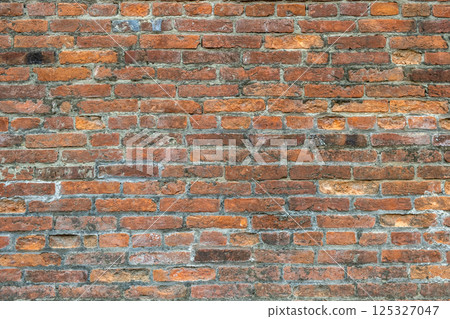 Weathered old red brick background with rough surface. 125327047