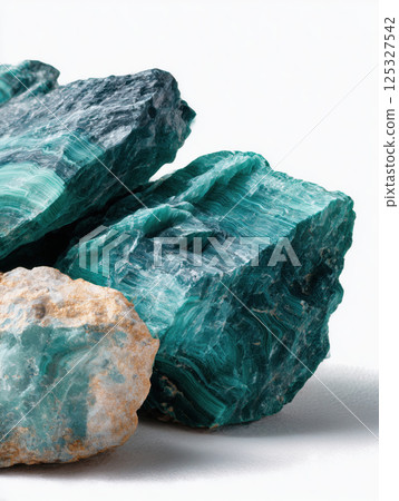Macro close-up of beautiful malachite gemstones showing layered green rings and smooth texture. Studio mineral photography. Geology and decorative stone concept. Design for print, wallpaper, banner. Macro close-up of beautiful malachite gemstones showing layered green rings and smooth texture. Studio mineral photography. Geology and decorative stone concept. Design for print, wallpaper, banner. 125327542