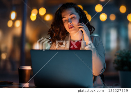 businesswoman working on laptop 125327559