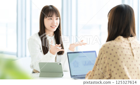 Two women/businesswomen having a meeting 125327614
