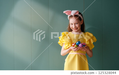 Girl with painted eggs Girl with painted eggs 125328044