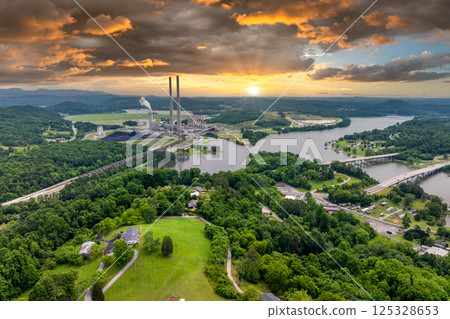 Residential neighborhood close to thermal power plant in Roane County near Kingston, Tennessee. Coal fossil fuel causing environmental pollution during electric energy production in American grid 125328653