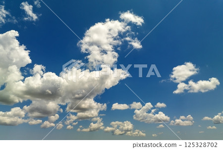 Rain clouds forming on blue Florida sky. Colorful summer skyscape Rain clouds forming on blue Florida sky. Colorful summer skyscape 125328702