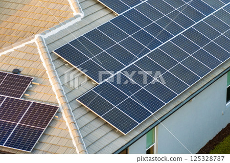 Photovoltaic solar panels on Florida home roof for producing clean ecological electric energy. Renewable electricity with zero emission concept 125328787