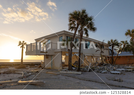 Natural disaster and its consequences. Hurricane destroyed houses roof and walls in Florida coastal area 125328814