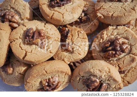 the cracked shortbread cookies with walnuts. sweet biscuit. whea the cracked shortbread cookies with walnuts. sweet biscuit. whea 125328824