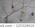 colorful eggs are on pussy twigs or branches willow. easter decor on light background with copy space 125328910