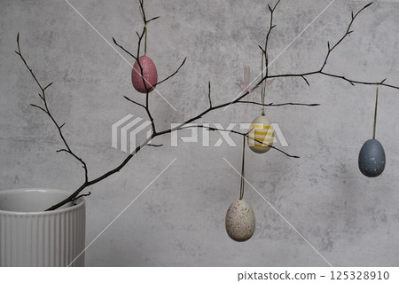 colorful eggs are on pussy twigs or branches willow. easter decor on light background with copy space colorful eggs are on pussy twigs or branches willow. easter decor on light background with copy space 125328910