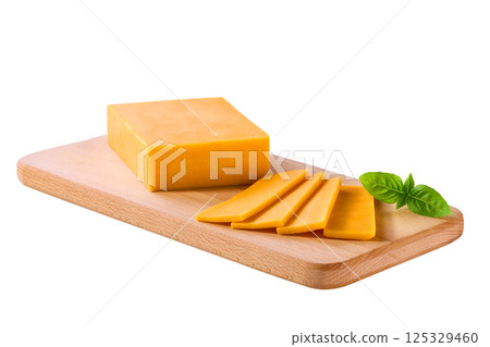 cheddar cheese cut into slices on a cutting board isolated on a white background. cheddar cheese cut into slices on a cutting board isolated on a white background. 125329460