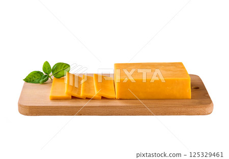 cutting board with pieces of red cheddar cheese isolated on a white background. 125329461