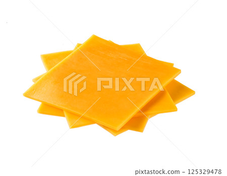slices of tasty cheddar cheese isolated on a white background. 125329478