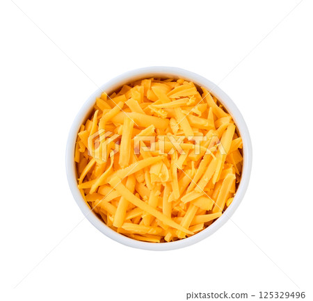 white ceramic bowl with shredded cheddar cheese isolated on a white background, top view. 125329496