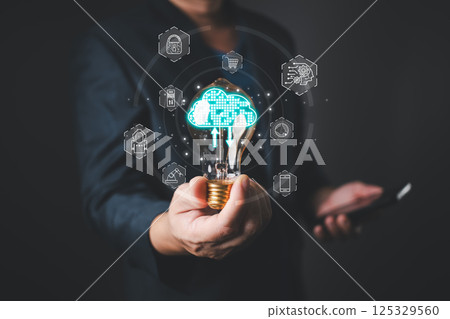 A glowing lightbulb represents innovation in cloud technology, showcasing its impact on digital transformation,business strategy,and the integration of advanced tools to enhance efficiency and growth. A glowing lightbulb represents innovation in cloud technology, showcasing its impact on digital transformation,business strategy,and the integration of advanced tools to enhance efficiency and growth. 125329560