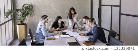 Group of businesspeople gathered for project or business strategy planning Group of businesspeople gathered for project or business strategy planning 125329871