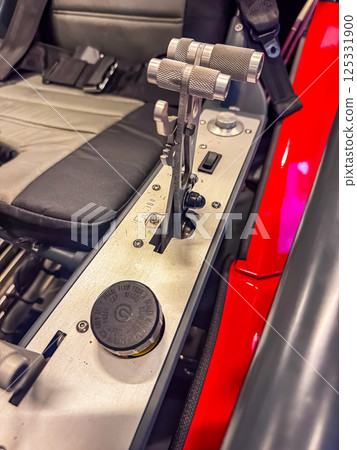 Close-up of vintage aircraft throttle controls and switches beside pilot seat. High quality photo 125331900