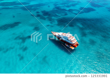 Aerial view of luxury yacht and boat in blue sea in summer 125331991