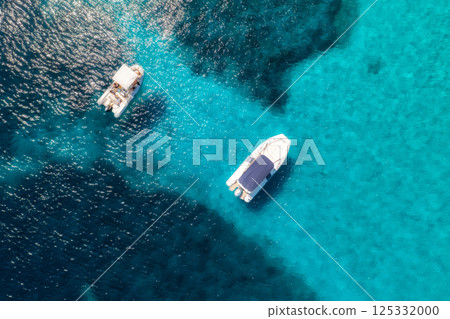 Aerial view of luxury yacht and boat in blue sea in summer 125332000