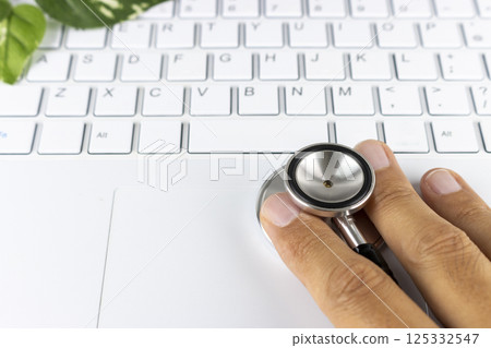 Laptop, hand and stethoscope. Image of computer malfunction 125332547