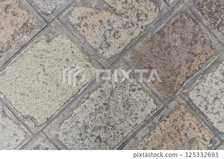 Weathered Stone Pavement with Geometric Pattern 125332693