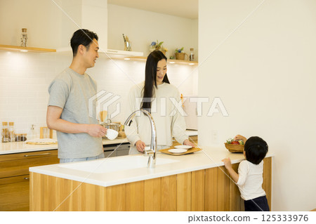 A couple standing in the kitchen A couple standing in the kitchen 125333976