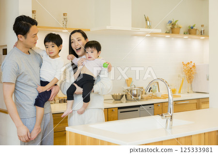 A couple standing in the kitchen A couple standing in the kitchen 125333981