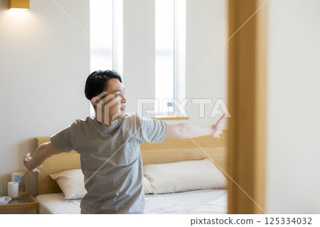 Men sitting on bed 125334032