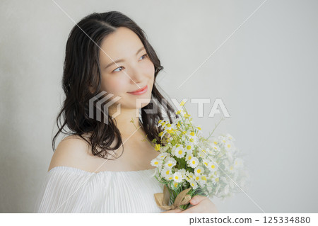 Young woman in a wedding dress 125334880