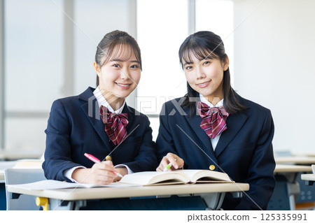 High school girls studying. Photo courtesy of Denpa Gakuen, Tokyo Electronics College. High school girls studying. Photo courtesy of Denpa Gakuen, Tokyo Electronics College. 125335991
