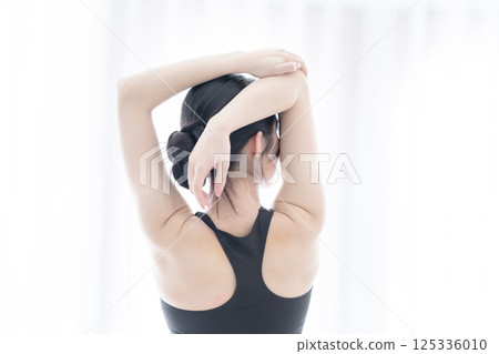 A beautiful view of a woman putting a tray on a white background A beautiful view of a woman putting a tray on a white background 125336010
