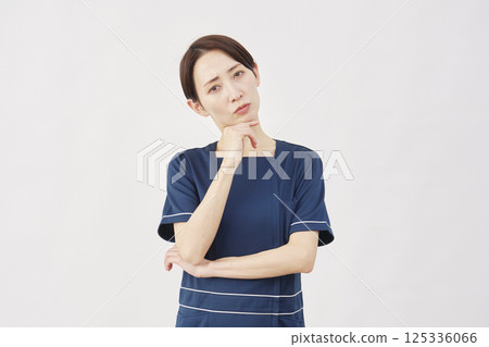 Female beauty nurse thinking white background Female beauty nurse thinking white background 125336066