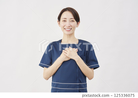 Female beauty nurse feeling relieved white background Female beauty nurse feeling relieved white background 125336075